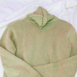green turtleneck sweater